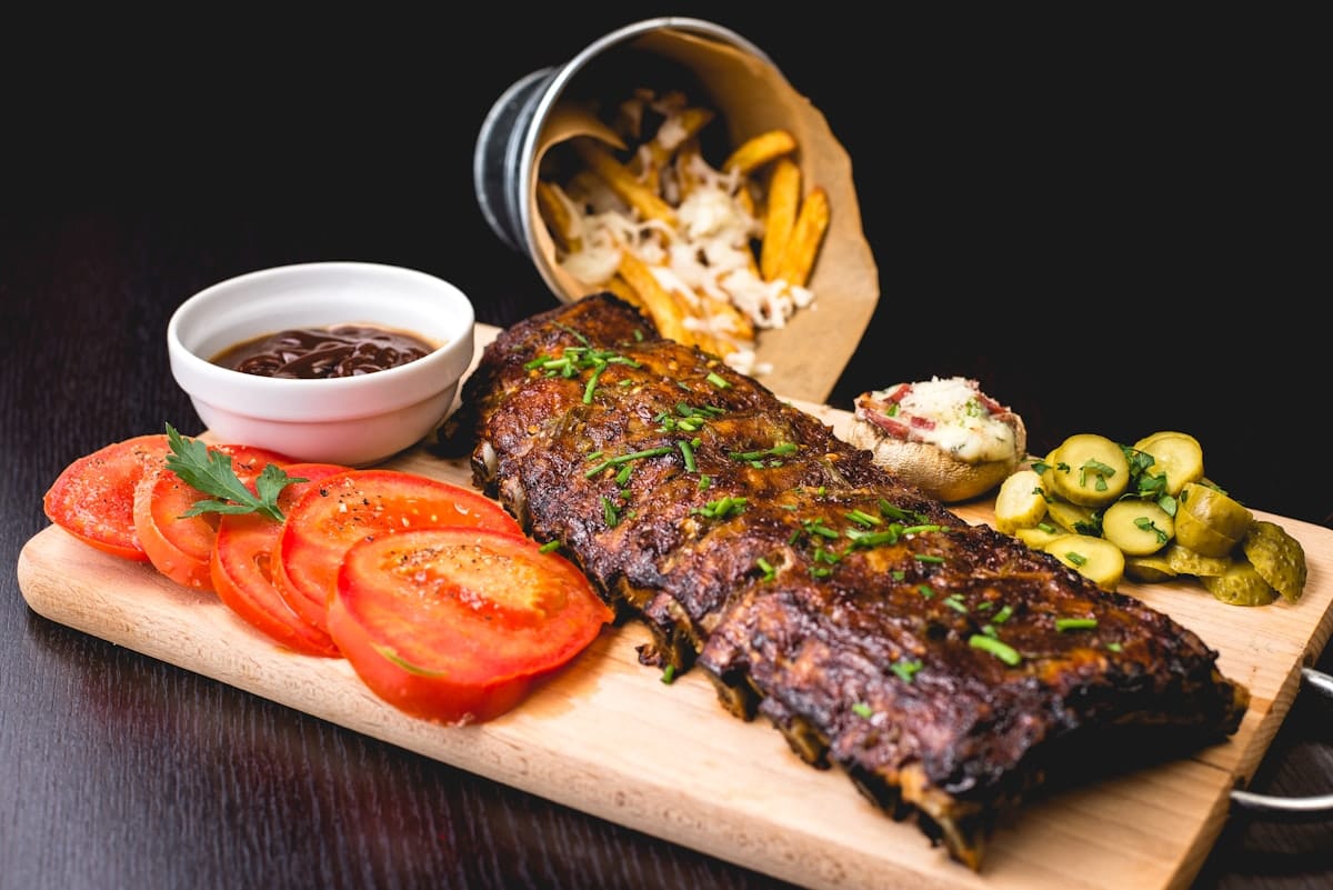 Grilled ribs on a wooden board